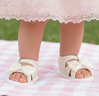 BPS050-IP Patent Ivory Bow Soft Sole Sandal (0-3)